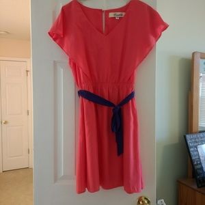 Coral dress with purple sash belt